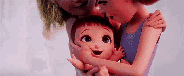 a woman is holding a baby in her arms and kissing it