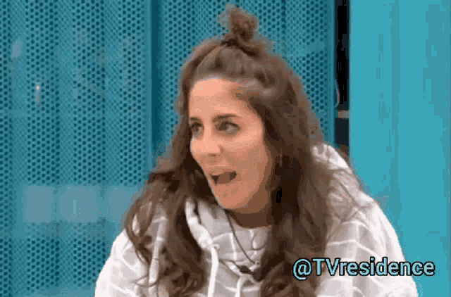 a woman is making a funny face with the words @tvresidence above her