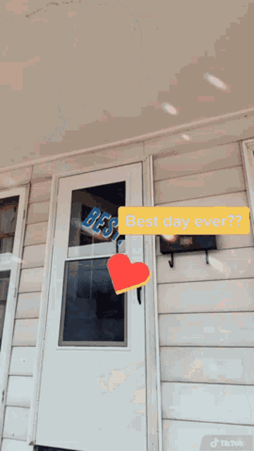a door with a heart and the words best day ever