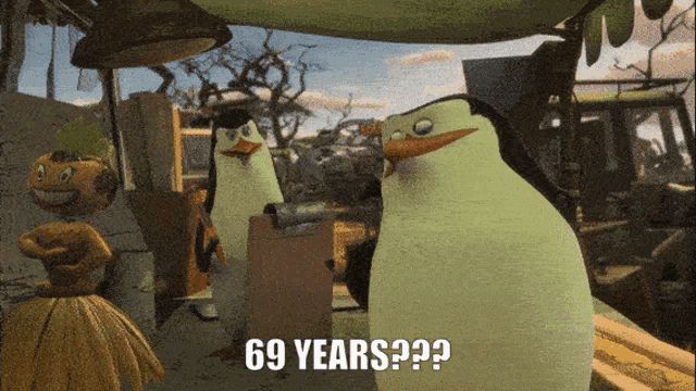 a group of penguins standing next to each other with 69 years written on the bottom