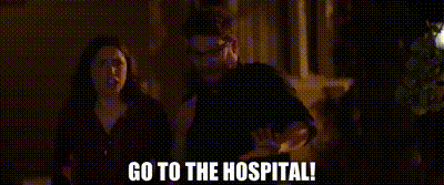 a man and a woman are standing next to each other in a dark room with the words `` go to the hospital ! ''