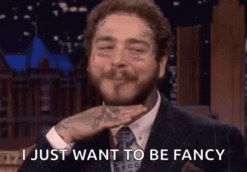 a man in a suit and tie is saying i just want to be fancy