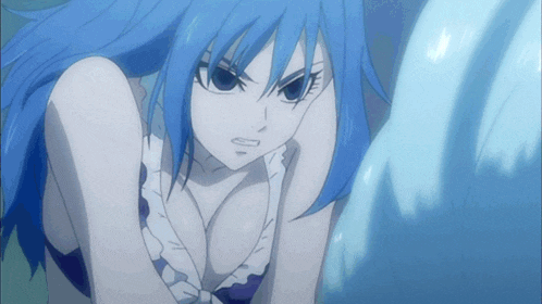 a girl with blue hair and a plunging neckline looks angry