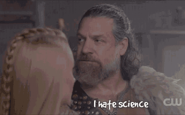 a man with a beard stands next to a woman with the words i hate science written below him