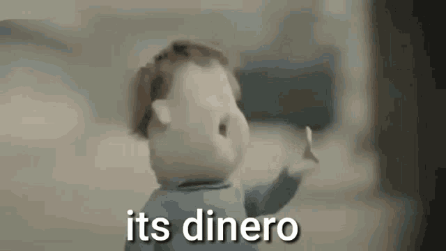 a cartoon baby is saying `` its dinero '' while holding a stick .