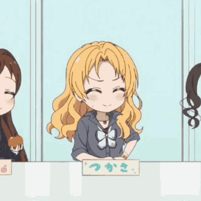 a girl with blonde hair is behind a sign that says ' tsuki '