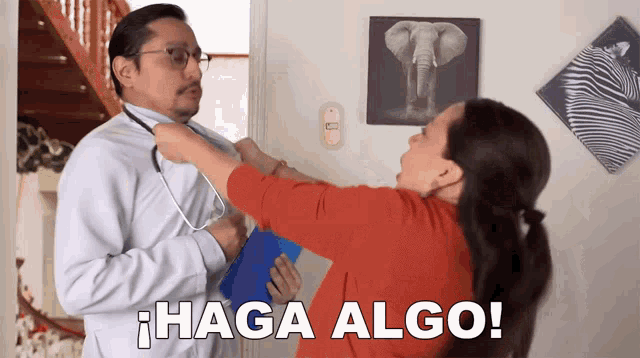 a woman is putting a stethoscope around a man 's neck and says " haga algo " in spanish