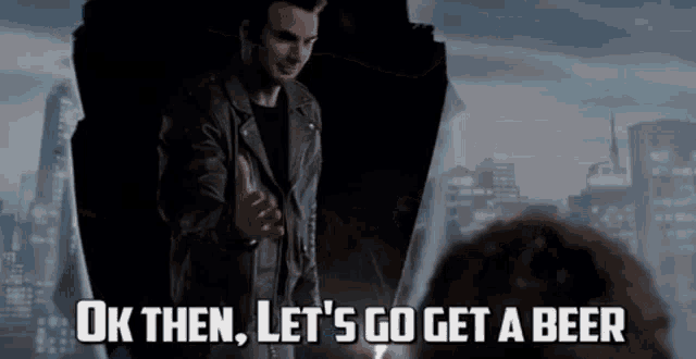 a man in a leather jacket is giving a thumbs up and says ok then let 's go get a beer .