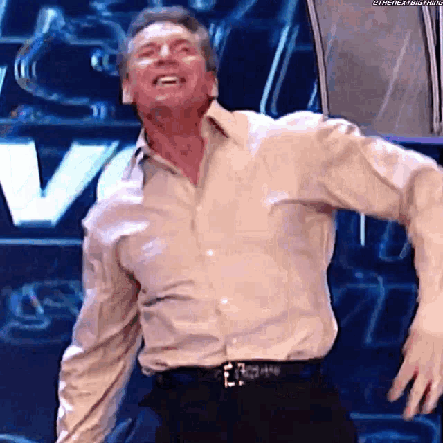 a man in a white shirt and black pants is dancing on a stage