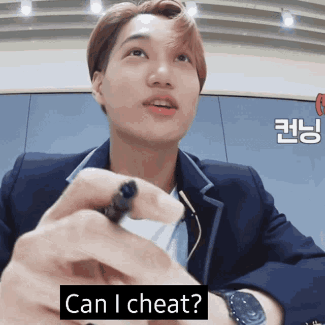 a man in a suit is holding something in his hand and the words can i cheat are below him