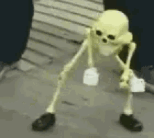 a glow in the dark skeleton is standing on the ground holding a piece of paper .