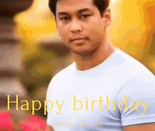 a man in a blue shirt is standing in front of a yellow background that says happy birthday