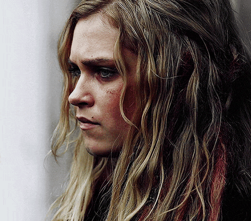 a close up of a woman with long blonde hair