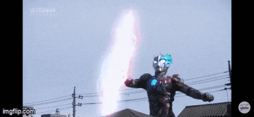 a man in a superhero costume is standing in front of a building holding a sword .