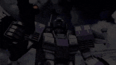 a purple and white robot with a gun is standing in front of an airport .