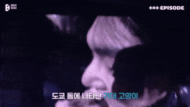 a close up of a person 's face with korean writing on the bottom right