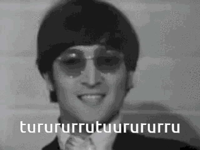 a black and white photo of a man wearing sunglasses with a caption that says " turunurruutuurururru "