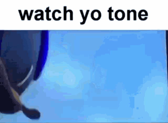 a penguin is swimming in the water with the words `` watch yo tone '' written above it .