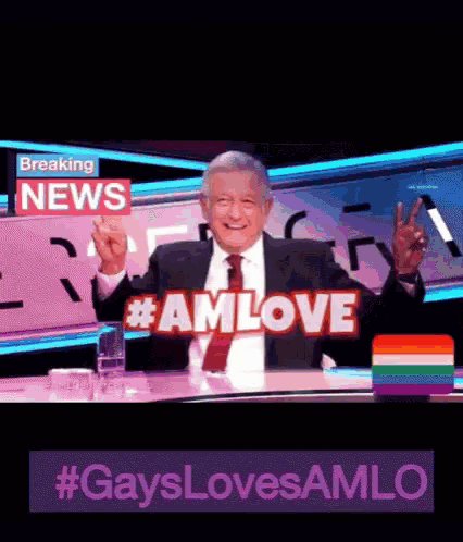a man in a suit and tie is giving a peace sign in front of a sign that says breaking news #amlove