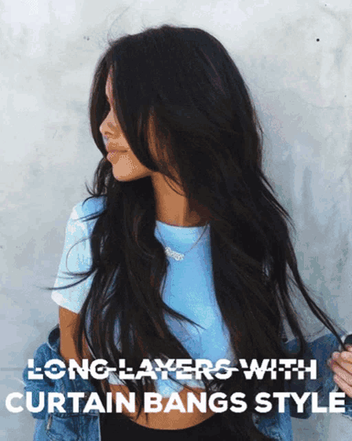 a woman with long hair is wearing a blue shirt with the words long layers with curtain bangs style on it