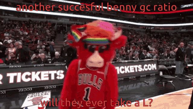 a bulls mascot wearing a rainbow hat stands in front of a banner for tickets.com