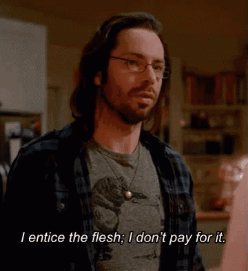a man wearing glasses and a plaid shirt says i entice the flesh i don 't pay for it