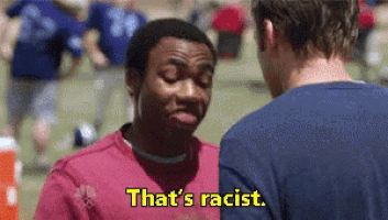 two men are talking to each other and one of them is saying `` that 's racist . ''
