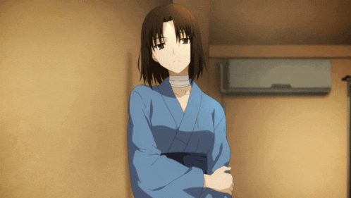 a woman in a blue kimono with a bandage around her neck