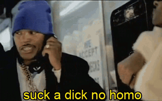 a man talking on a phone with the words suck a dick no homo written below him