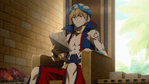 a man in a turban is sitting in a chair holding a piece of paper