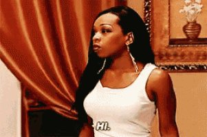 a woman wearing a white tank top that says cl