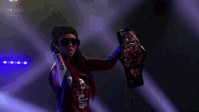 a woman holding a wrestling championship belt that says chicago on it