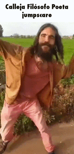 a man with a beard wearing pink pants and a brown jacket
