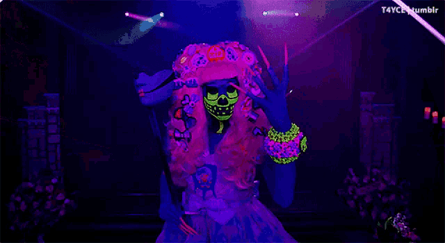 a person wearing glow in the dark clothes and a hat with rip written on it