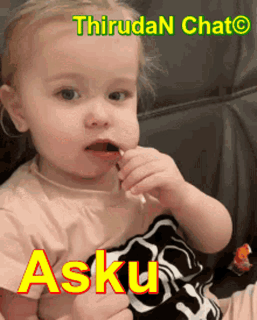a little girl is eating a lollipop with the name asku written on the bottom