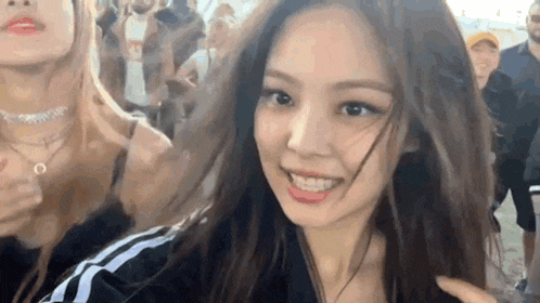 a close up of a woman 's face with long hair .
