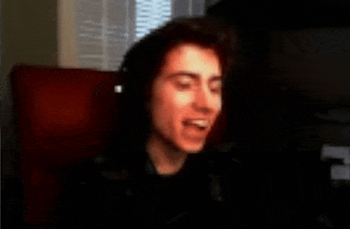 a blurry photo of a man wearing headphones