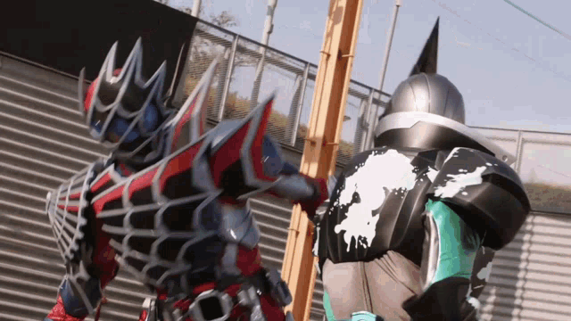 a couple of cartoon characters standing next to each other with a fence in the background