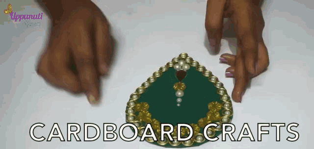 a person is making a cardboard craft with the words cardboard crafts in the corner