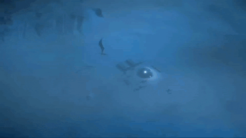 an animated image of a dragon with a blue sky in the background