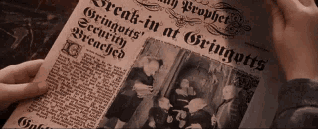 a person is holding a newspaper that says " break-in at gringotts "
