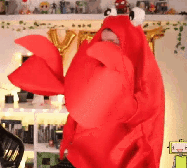 a person in a lobster costume is dancing in a room with balloons .