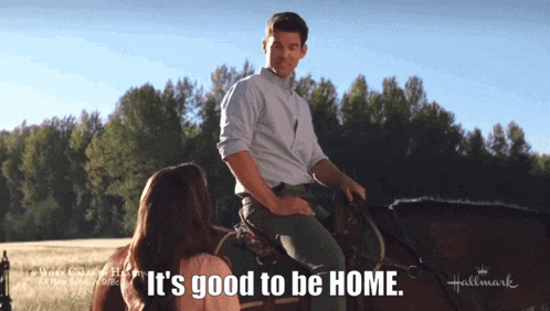 a man riding a horse with the words it 's good to be home behind him