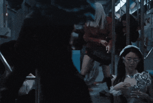a woman in a white dress is holding a trophy on a bus