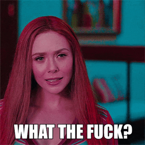 a woman with red hair is looking at the camera and says `` what the fuck '' .