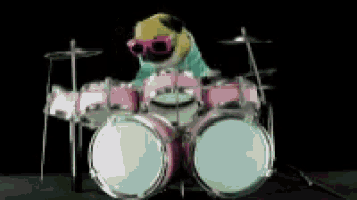 a pug dog wearing sunglasses is playing a drum set