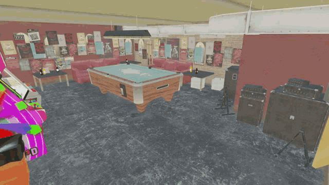 a pool table in a room with posters on the wall including one that says ' i love you ' on it