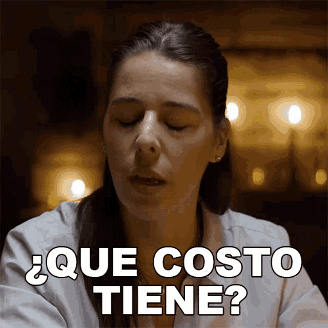 a woman with her eyes closed has que costo tiene written above her