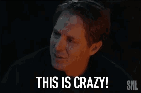 a man is saying `` this is crazy '' in a dark room .