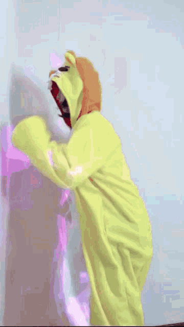a girl in a yellow and white costume with a hood